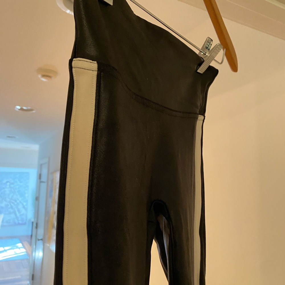 Spanx faux leather leggings with white stripe down the leg.  Barely worn.